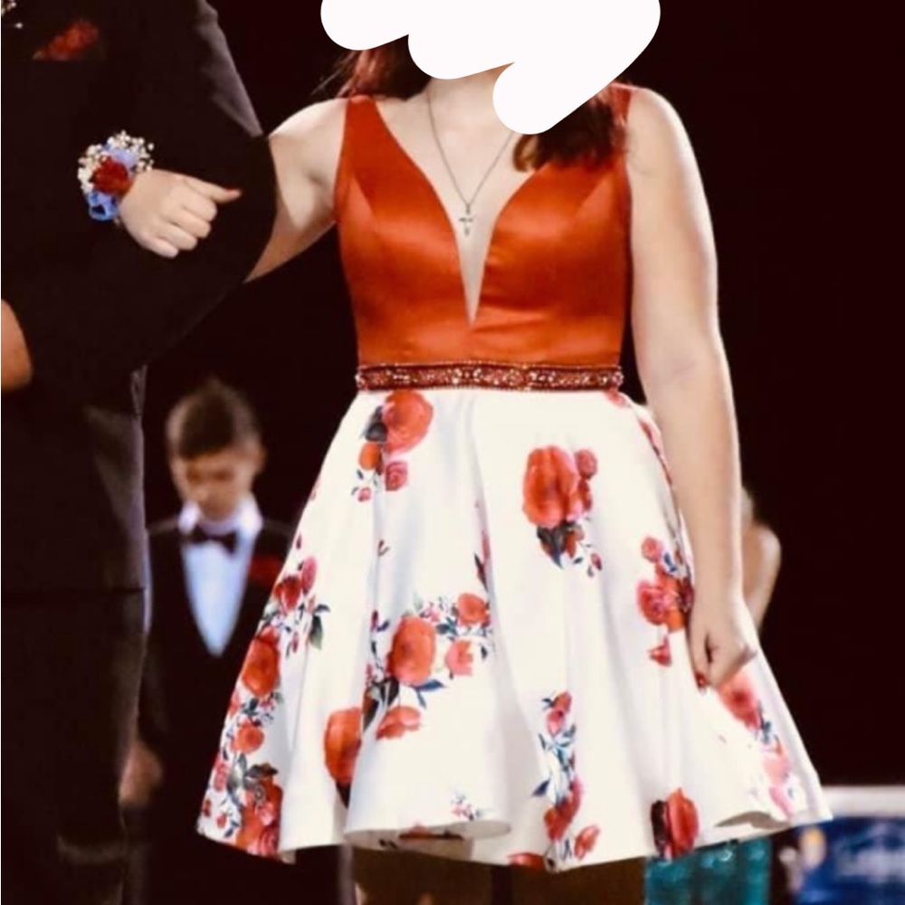 Prom/homecoming dress. white with red flowers it also has pockets!!